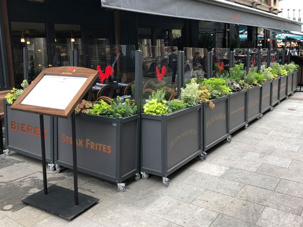 Napoli Planters with removable windbreaker outside restaurant seating area