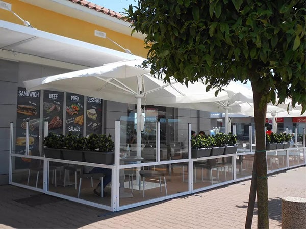 Roma windbreaks creating outside eating area